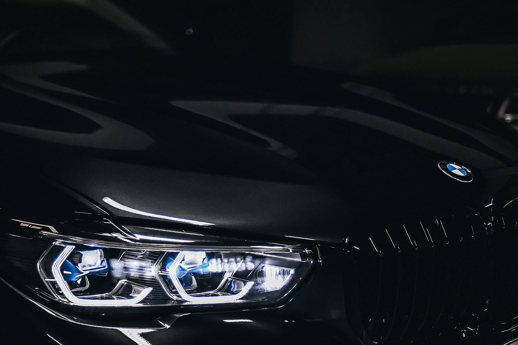 Black car front end lit at night